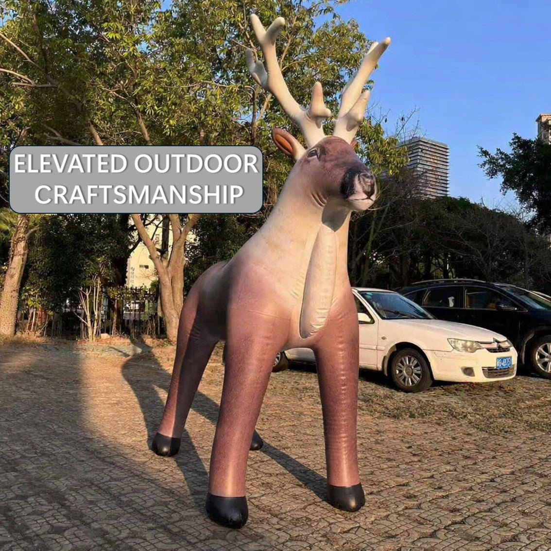 Inflatable deer statue with 'Elevated Outdoor Craftsmanship' text in a park setting. by Jet Creations